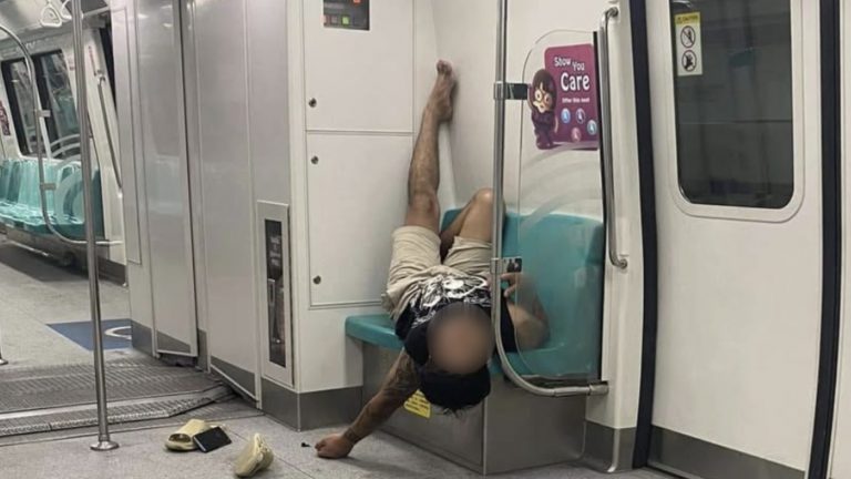 Netizens call out MRT passenger for posting “discriminatory” photo of another passenger sleeping on train